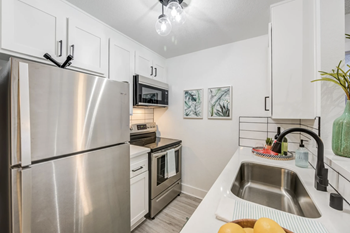 Quartz or granite counter tops in kitchen (in select apartments)